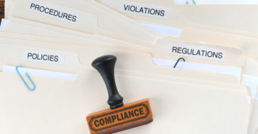 Compliance rubber stamp on folders marked policies 2023 06 06 00 02 13 utc